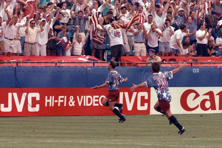 PONTIAC, MICHIGAN - JUNE 18: Eric Wynalda #11 of the United States celebrates his tying goal from a free kick just before halftime in the Opening Match of the 1994 World Cup played between the host team United States and Switzerland in front of a Pontiac Silverdome crowd of 73,425 on June 18, 1994 in Pontiac, Michigan. (Photo by Perry McIntyre/ISI Photos/Getty Images)