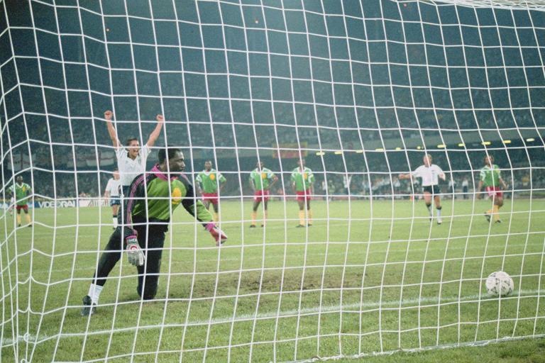 Gary Lineker of England scores the second penalty against goalkeeper Thomas Nkono of the Cameroon during the 1990 FIFA World Cup Quarter Final on 1 July 1990 at the San Paolo Stadium in Naples, Italy. England defeated Cameroon 3-2 after extra time. (Photo by Getty Images)
