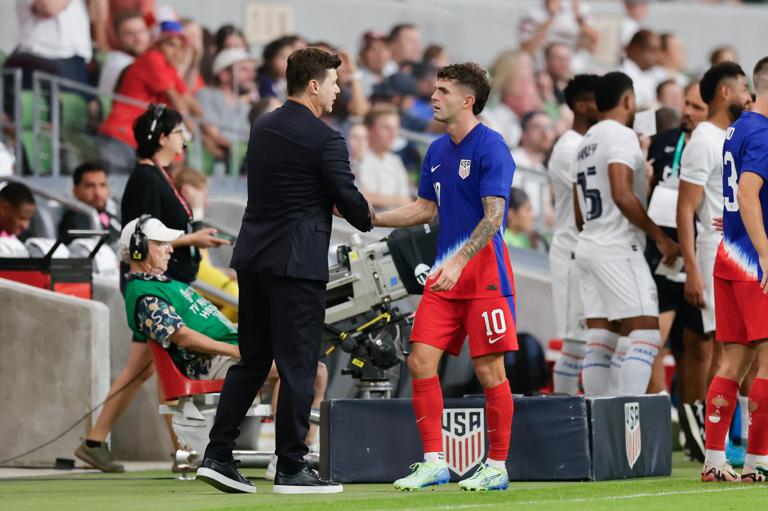 AUSTIN, TEXAS - OCTOBER 12: United States head coach Mauricio Pochettino greets Christian Pulisic #10 of the United States as he is subbed off during a game against Panama at Q2 Stadium on October 12, 2024 in Austin, Texas. (Photo by Logan Riely/USSF/Getty Images for USSF)
